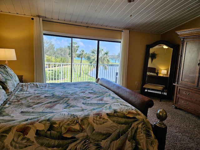 530 Sandy Hook Rd, Treasure Island, FL 33706 - bedroom featuring carpet flooring, access to outside, and wood ceiling