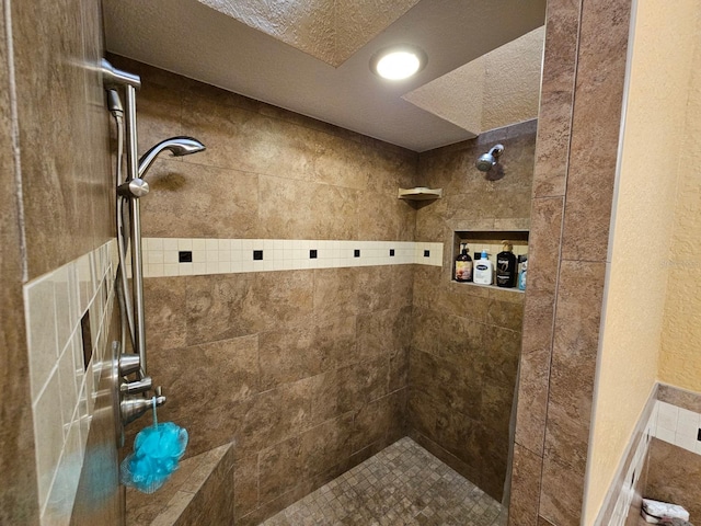 530 Sandy Hook Rd, Treasure Island, FL 33706 - full bath with a tile shower and a textured ceiling