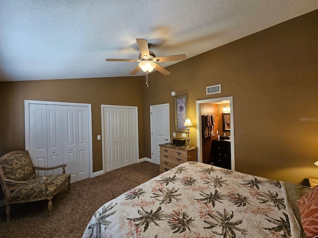 530 Sandy Hook Rd, Treasure Island, FL 33706 - bedroom featuring two closets, a ceiling fan, visible vents, dark carpet, and high vaulted ceiling