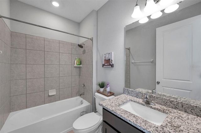 bathroom with toilet, tub / shower combination, and vanity