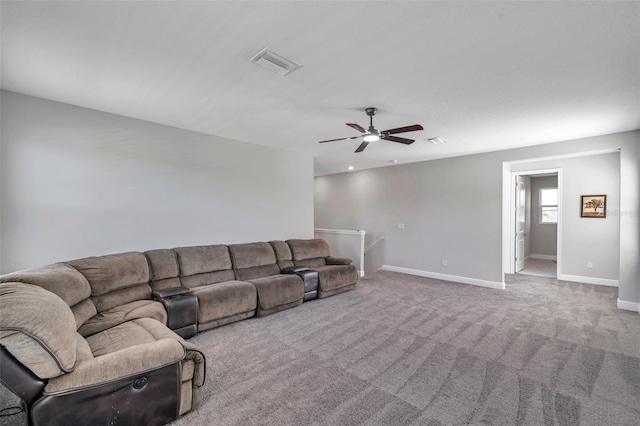 living area featuring a ceiling fan, light colored carpet, visible vents, and baseboards