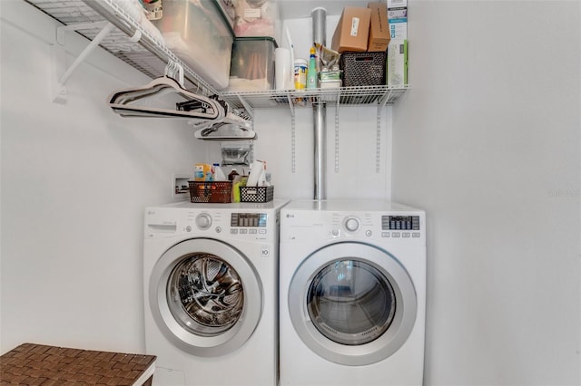 washroom featuring laundry area and independent washer and dryer