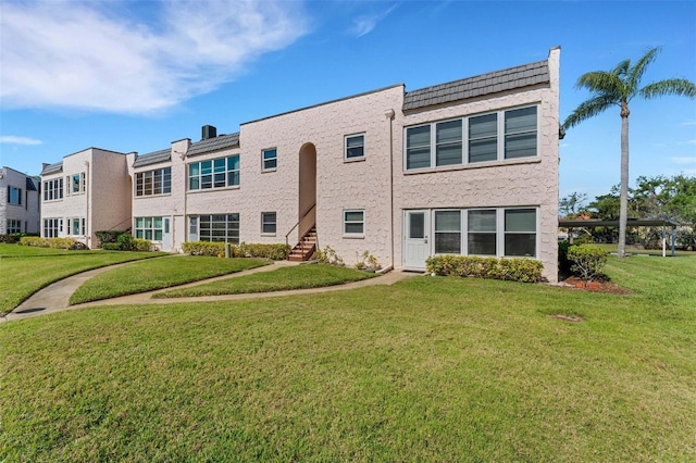 view of front of home with a front yard