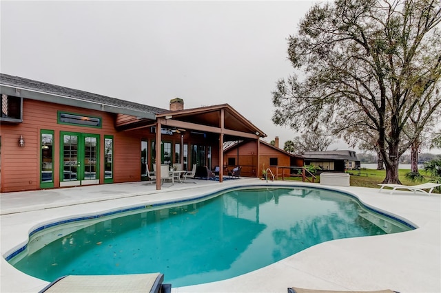 outdoor pool featuring a patio