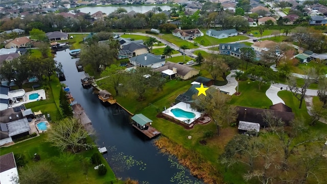 aerial view with a residential view and a water view