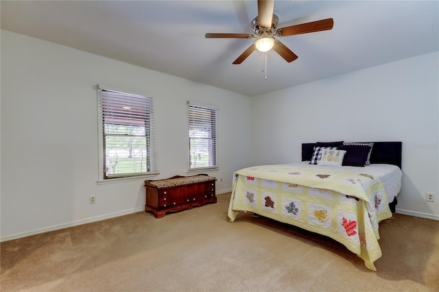 bedroom featuring carpet floors, ceiling fan, and baseboards