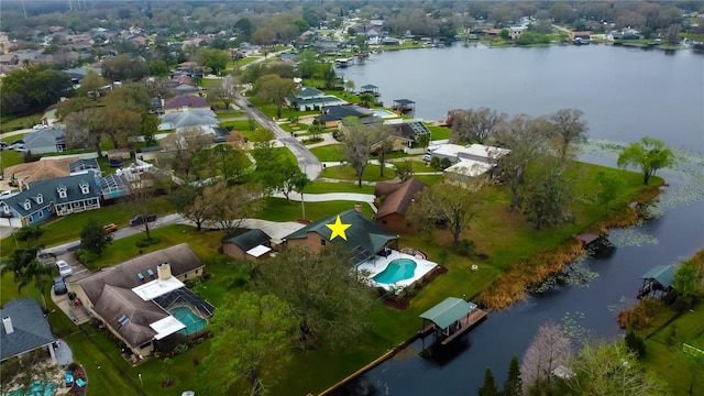 bird's eye view featuring a water view and a residential view