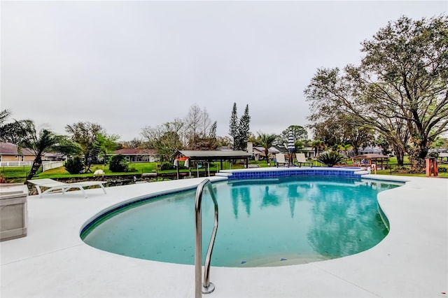 pool with a patio area