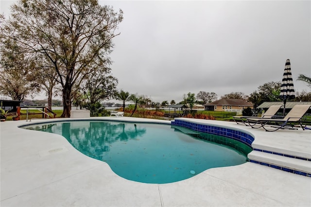 pool featuring a patio and fence