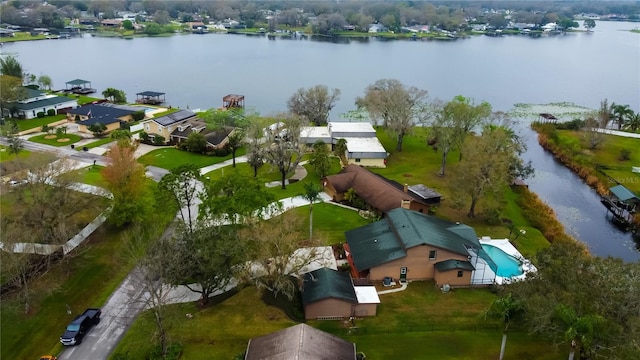 drone / aerial view featuring a water view and a residential view