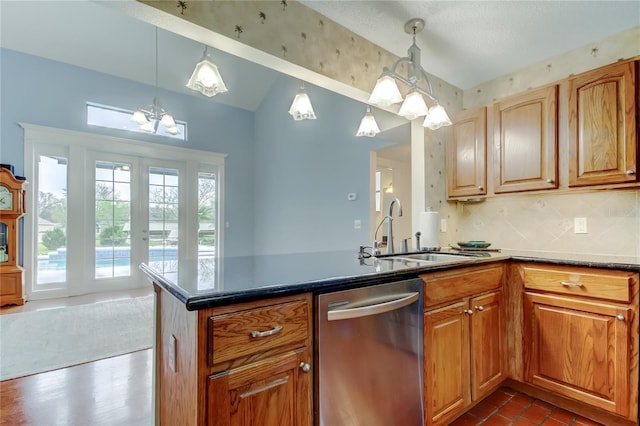 kitchen featuring french doors, decorative backsplash, a sink, dishwasher, and a peninsula