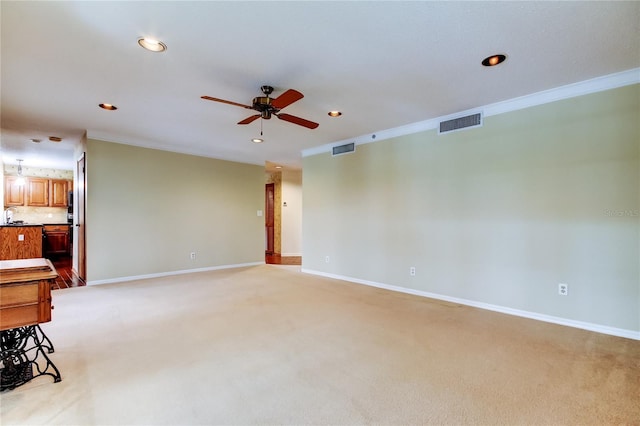 unfurnished living room with light carpet, baseboards, and visible vents