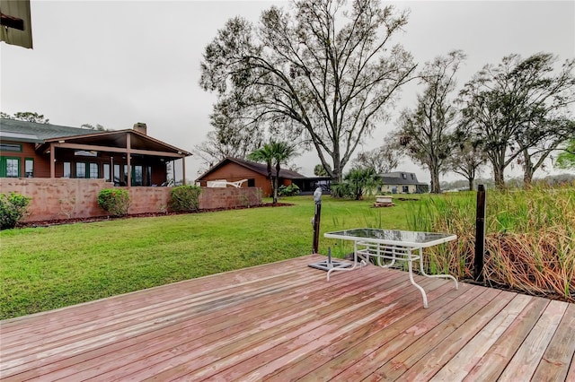 deck featuring a yard