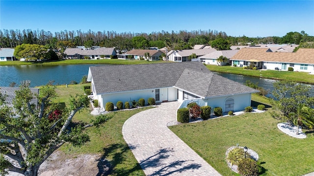 aerial view with a residential view and a water view