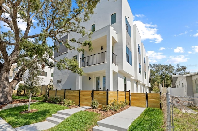 view of building exterior featuring a fenced front yard