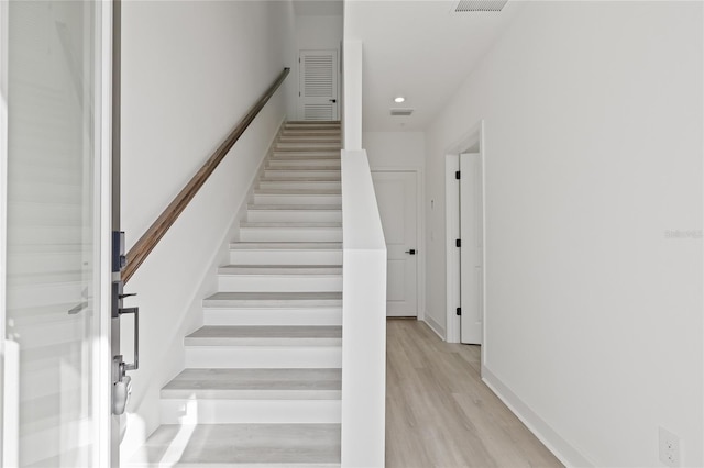307 15th St N, Saint Petersburg, FL 33705 - stairway featuring recessed lighting, wood finished floors, and baseboards