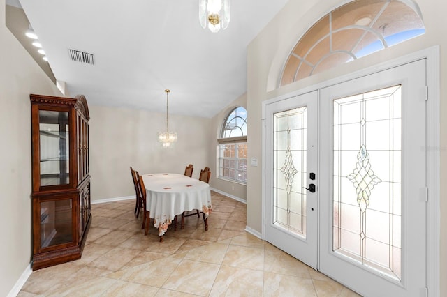 2015 Golf Manor Blvd, Valrico, FL 33596 - entrance foyer with baseboards, visible vents, lofted ceiling, french doors, and a notable chandelier