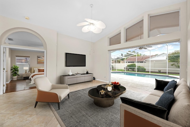 2015 Golf Manor Blvd, Valrico, FL 33596 - living room with light tile patterned floors, visible vents, a sunroom, and vaulted ceiling