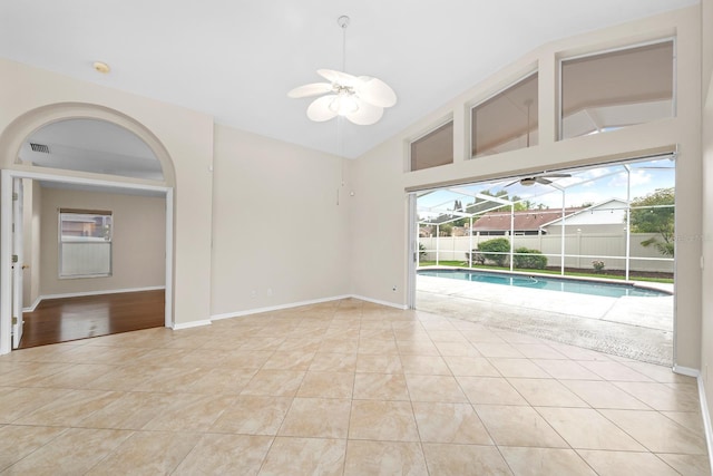 2015 Golf Manor Blvd, Valrico, FL 33596 - spare room with tile patterned flooring, a ceiling fan, and vaulted ceiling