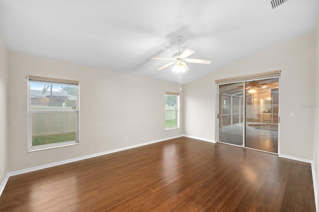 2015 Golf Manor Blvd, Valrico, FL 33596 - unfurnished bedroom with visible vents, baseboards, dark wood finished floors, lofted ceiling, and access to exterior