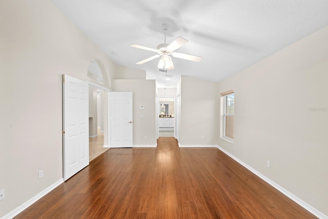 2015 Golf Manor Blvd, Valrico, FL 33596 - empty room featuring vaulted ceiling, a ceiling fan, baseboards, and wood finished floors