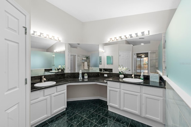 2015 Golf Manor Blvd, Valrico, FL 33596 - bathroom featuring double vanity, a stall shower, and a sink
