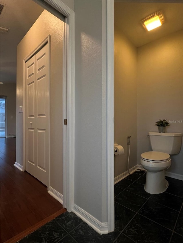 2015 Golf Manor Blvd, Valrico, FL 33596 - bathroom with baseboards and toilet