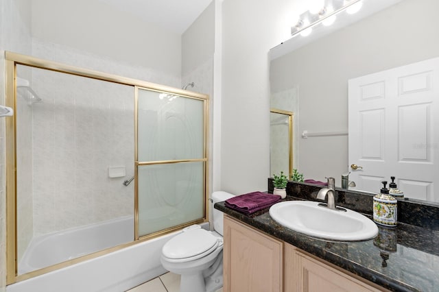 2015 Golf Manor Blvd, Valrico, FL 33596 - bathroom featuring shower / bath combination with glass door, toilet, vanity, and tile patterned flooring