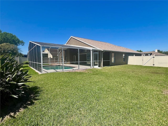 2015 Golf Manor Blvd, Valrico, FL 33596 - rear view of property featuring a fenced in pool, a lawn, glass enclosure, a fenced backyard, and a gate