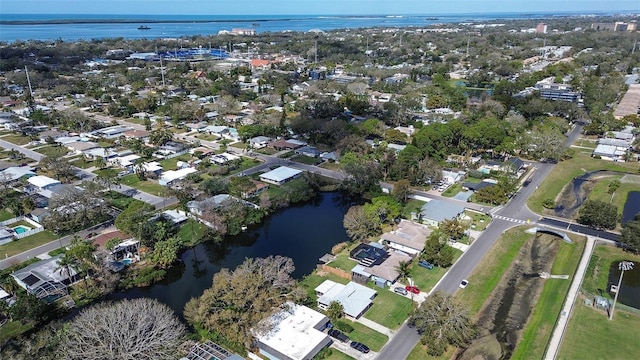 drone / aerial view with a residential view and a water view