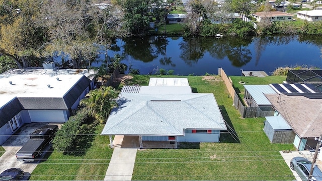 drone / aerial view featuring a water view and a residential view