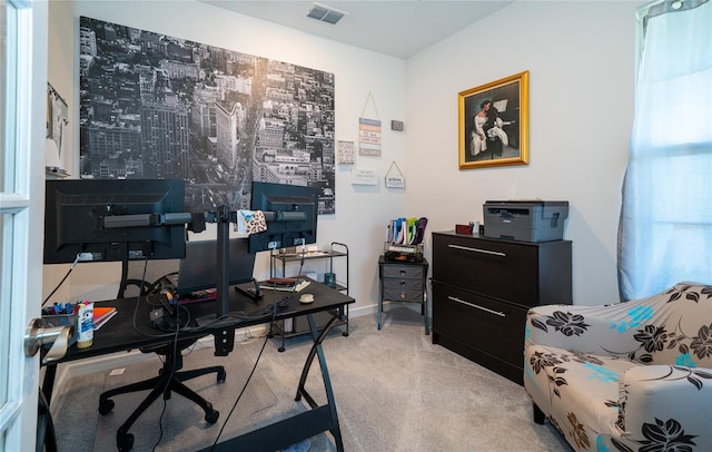 home office with visible vents and light carpet