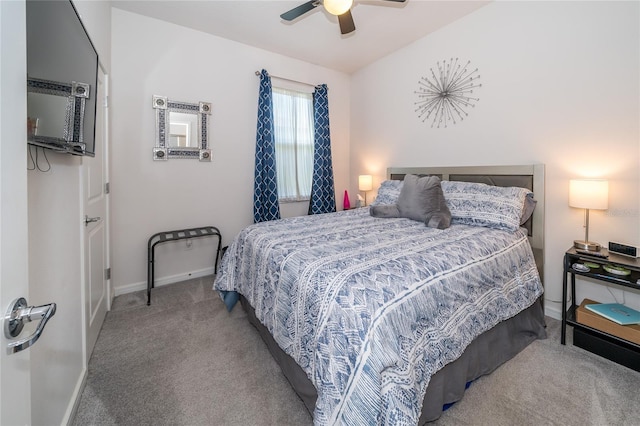 carpeted bedroom featuring a ceiling fan and baseboards