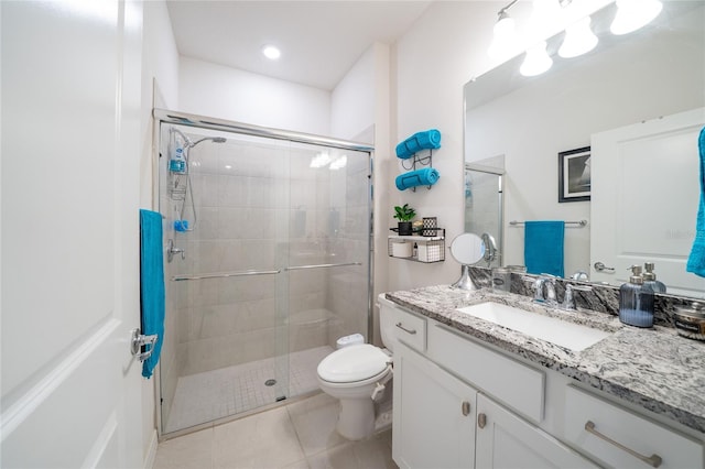 full bath featuring toilet, a stall shower, tile patterned floors, and vanity