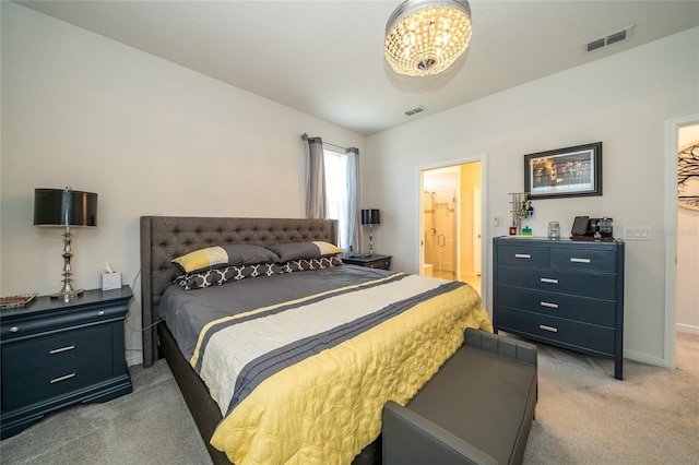 bedroom with light carpet, visible vents, and baseboards