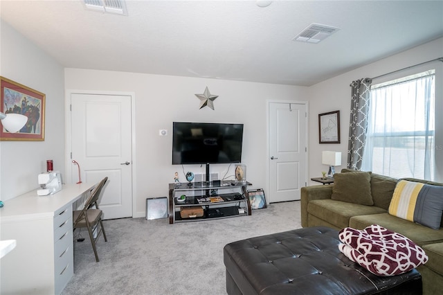 living area with carpet and visible vents