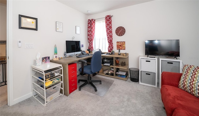 office with baseboards and light colored carpet