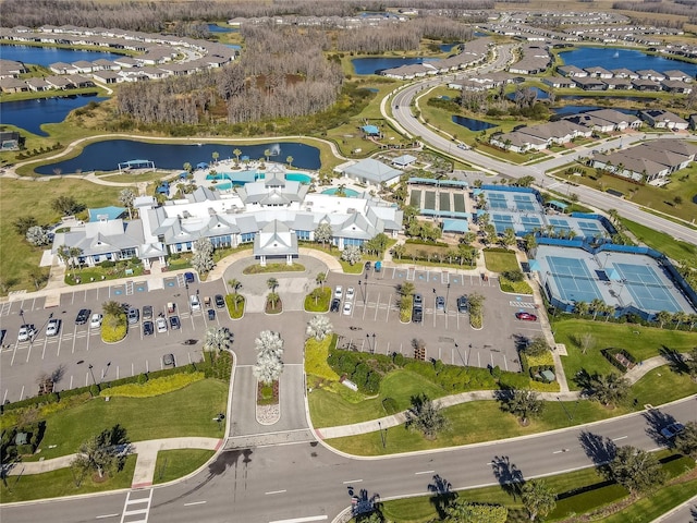 bird's eye view featuring a water view and a residential view