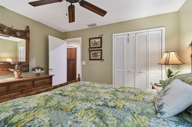 bedroom featuring ceiling fan, a closet, and visible vents