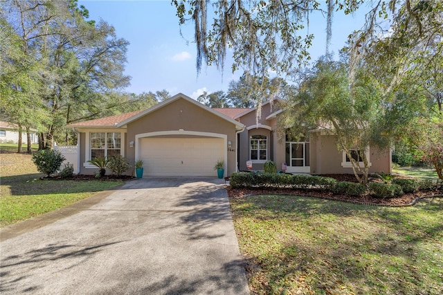 single story home with a front lawn and a garage