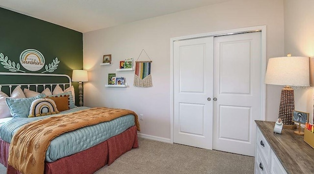 carpeted bedroom featuring a closet