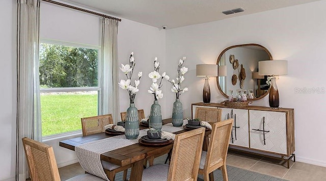 dining space with light tile patterned floors