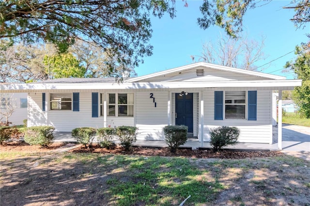 ranch-style house featuring covered porch