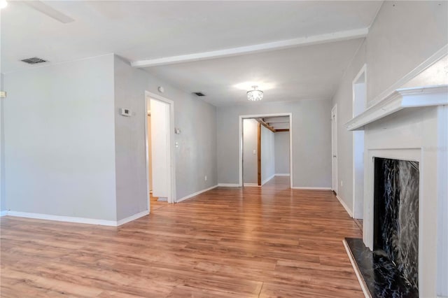 unfurnished living room with wood-type flooring