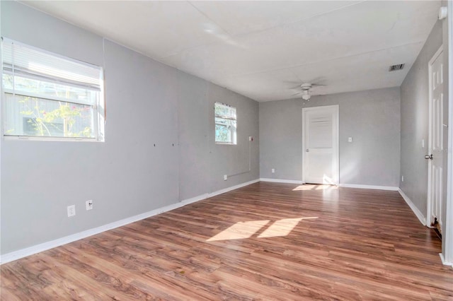 spare room with ceiling fan and wood-type flooring