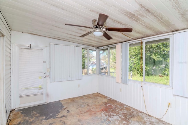 unfurnished sunroom with ceiling fan and wood ceiling