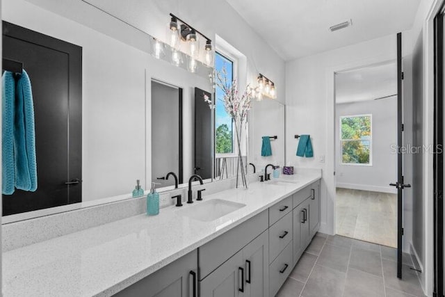 bathroom featuring tile patterned floors and vanity