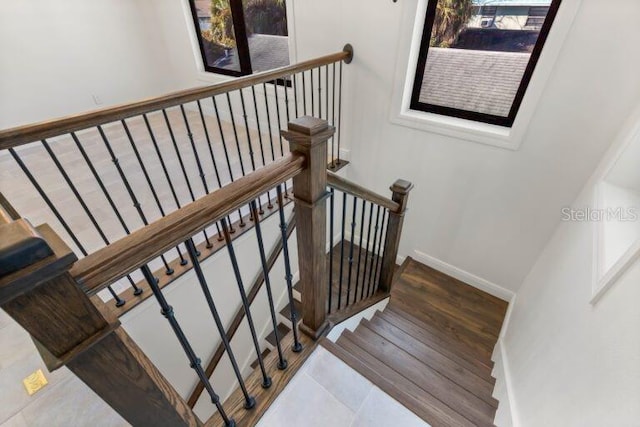 stairs with hardwood / wood-style flooring