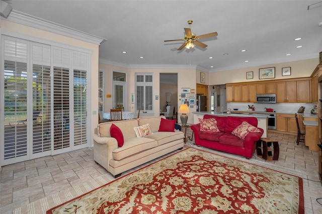 living area featuring recessed lighting, a ceiling fan, and ornamental molding