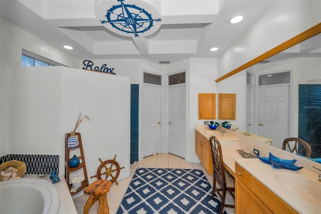 bathroom with vanity, tile patterned floors, recessed lighting, and a bathtub